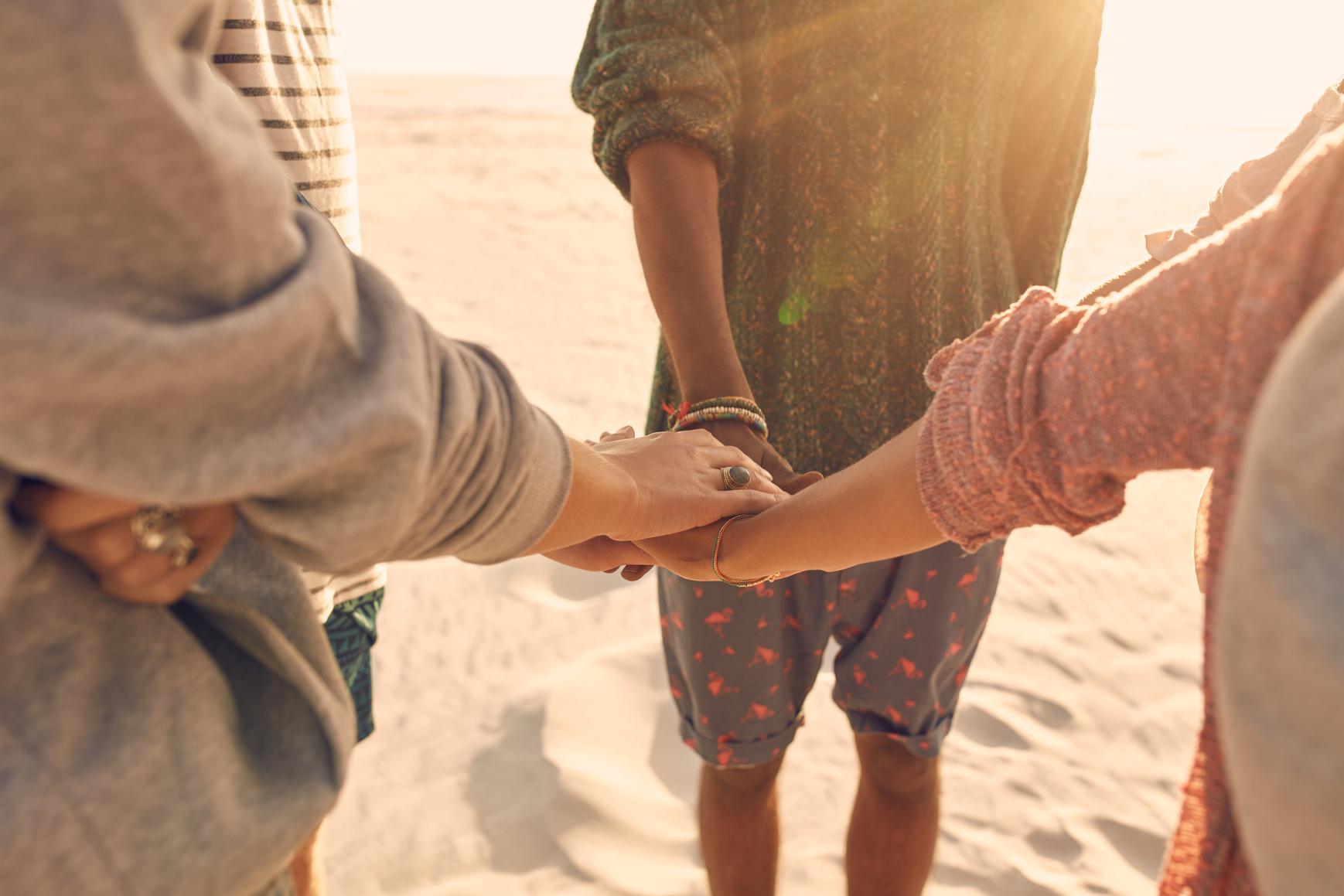 Group of Friends Stack Their Hands Together